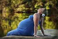 pregnant woman near lake